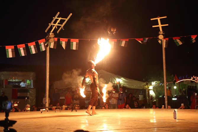 Al Madam Red Sand Safari with BBQ Dinner & Traditional Show - Red dunes, rolling 4x4s, and a seven-hour outing