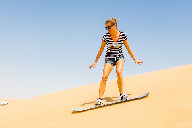 Desert Safari with BBQ Dinner, Camel Ride, Sand Board & Live Show - Dune bashing across the Lahbab sand