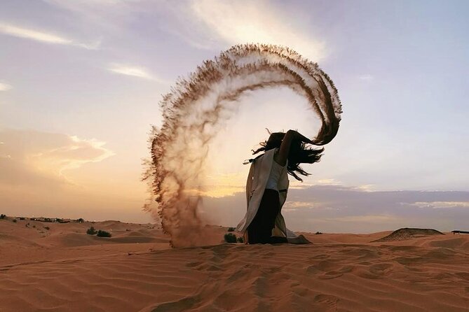 Desert Safari with Camel Ride, BBQ Dinner, Sand Board & Live Show - Sunset photographs and the short camel ride