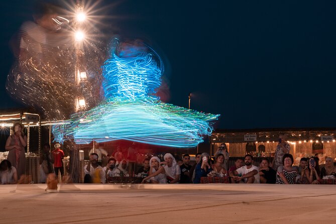 Desert Safari with Camel Ride, BBQ Dinner, Sand Board & Live Show - Belly dancing, Tanoura, and the fire show