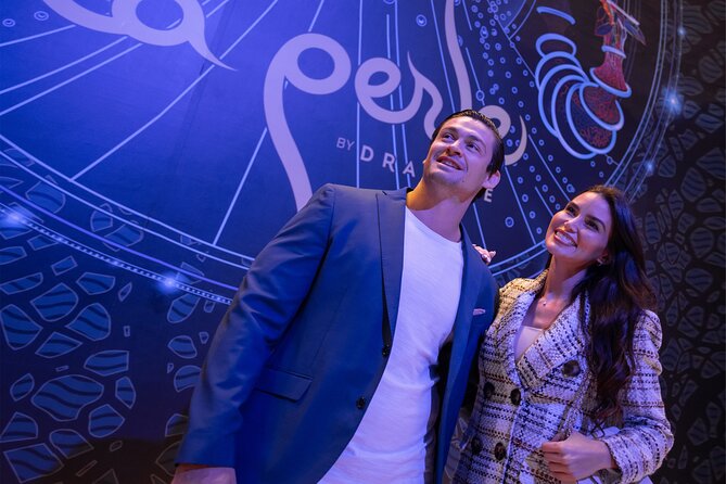 Dubai Canal Dinner Cruise with La Perle Show Tickets Combo - The waterfall bridge and Tolerance Bridge after dark