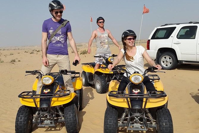 Dubai Desert Afternoon Quad Safari with Camel Ride, BBQ Dinner and Belly Dancing - Sunset photo stops on the open sand
