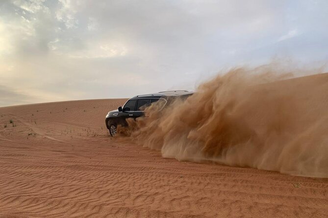 Dubai Desert Safari-BBQ Dinner, Belly Dance, Fire show - From Dubai streets to red dunes by 3 pm