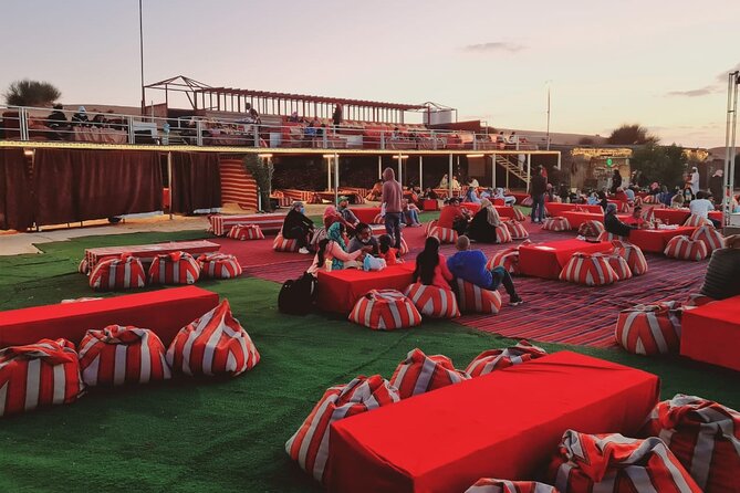 Dubai Desert Safari with Quad Bike, Camel Ride, Dinner and Show - Camel ride and sandboarding
