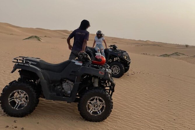 Dubai Desert Safari with Quad Bike, Camel Ride, Dinner and Shows - Red dunes and a 30-minute dune-bashing run