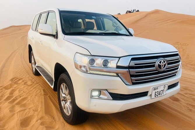 Dubai Evening Desert Safari with Quad bike, Dinner and Show - Dune bashing, photo stops, and sandboarding