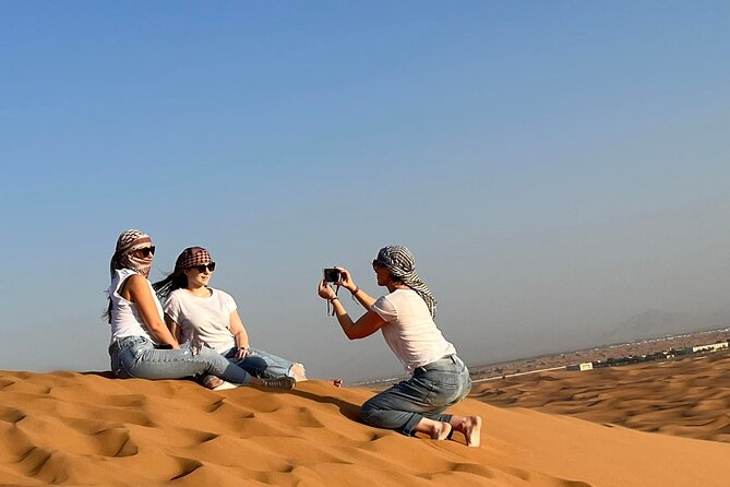 Dubai Evening Desert Safari with Quad bike, Dinner and Show - The camp evening: camel ride, henna, and dinner