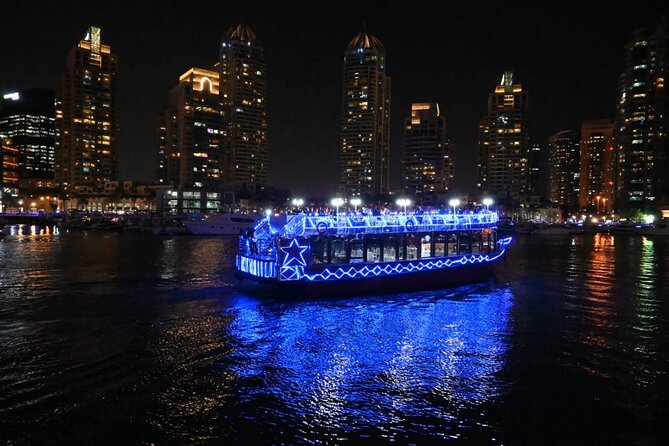 Dubai Marina Unique Dhow Cruise Buffet Dinner and Belly Dance - Dubai Marina after dark, seen from a wooden dhow