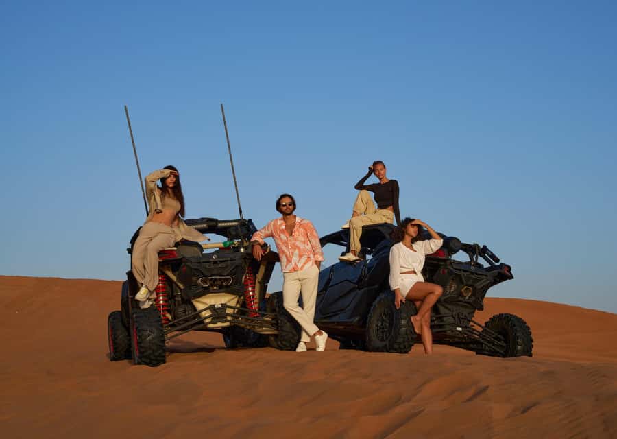 Dubai’s Best Desert Safari: Live Show & Gourmet BBQ Dinner - Sandboarding and desert photographs