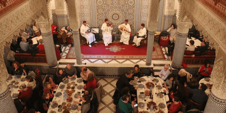 Fes : Unforgettable Dinner Show Experience with hotel pickup - Tagine, couscous, and the sweet side of Moroccan cooking