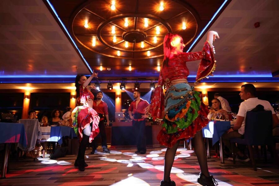 From Istanbul: Bosphorus Dinner Cruise Tavern & World Show - Boarding a luxury yacht at dusk