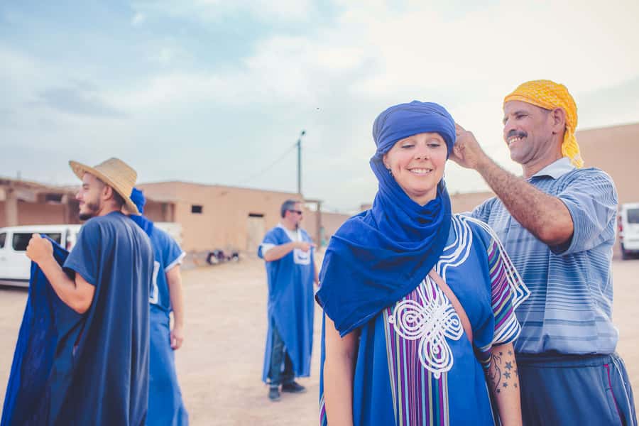 From Marrakech: Agafay Desert Camel Ride and Dinner and Show - A desert evening without the Sahara drive