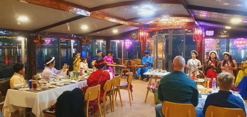 Hue: Perfume River Dinner Cruise with Traditional Show - Wearing Hue costumes aboard the boat