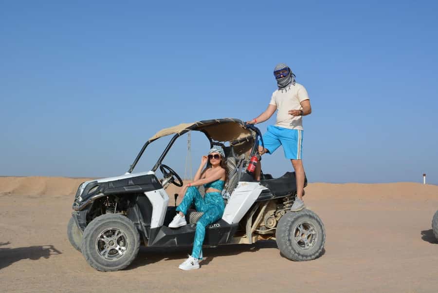 Hurghada: Quad and Buggy Safari with Dinner and Show - Sunset, rooftop views, and the desert setting