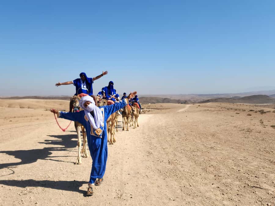 Marrakech: Agafay Camel Ride & Dinner with Fire Show Tour - Moroccan dinner with music and mint tea