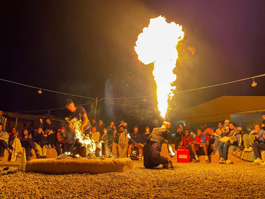 Marrakech: Agafay Desert: Camel ride Quad Bike, Dinner show - Riding camels as the sun goes down