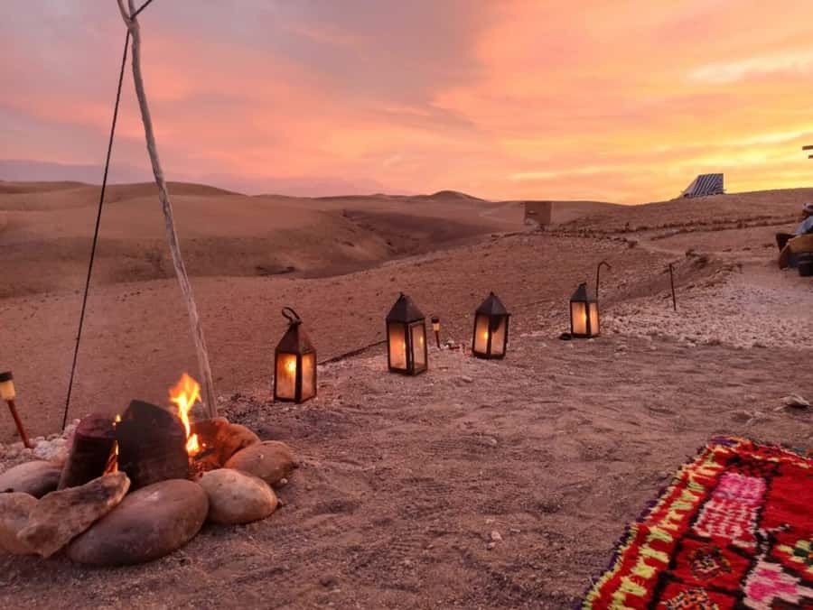 Marrakech: Dinner in Agafay Desert, Fire show & Camel Ride - Sunset in orange, pink, and gold
