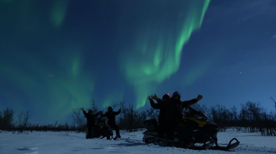 Premium Aurora Snowmobile Ride With Panoramic Views - Getting suited up for a Kiruna winter night