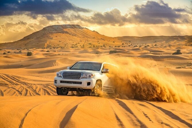 Private Desert Safari Dubai with BBQ Dinner and Belly Dance - Dune bashing with a licensed desert driver