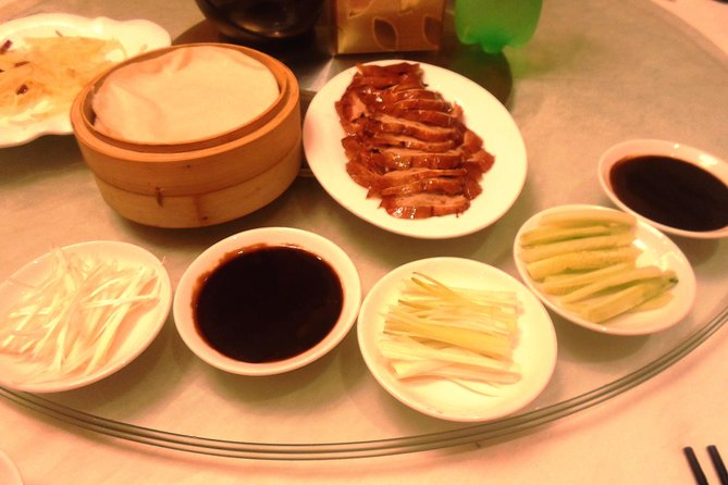 Private Tour to Pearl Market Acrobatic Show & Peking Duck Dinner - Peking duck at a local restaurant