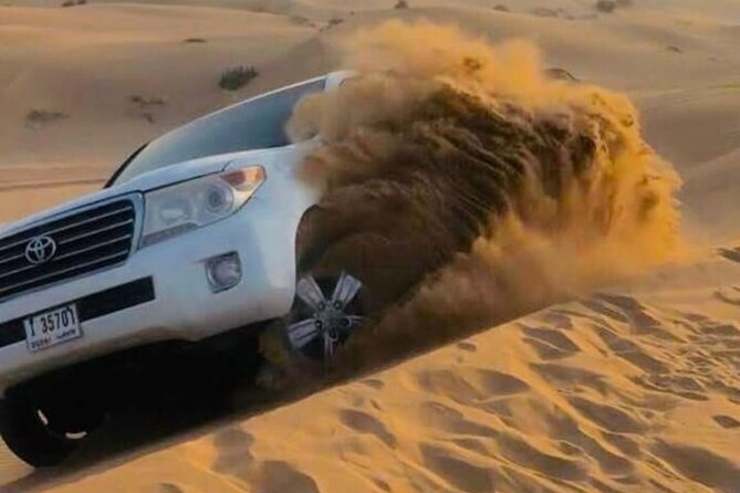 Quad Bike Dubai Desert Safari with BBQ Dinner Sandboard and Show - Sunset photos on the red dunes