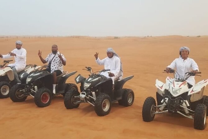 Quad Bike Dubai Desert Safari with BBQ Dinner Sandboard and Show - Quad biking on the Lahbab sand