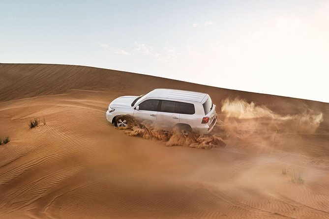 Red Dune Desert Safari with BBQ Dinner, Sand Boarding Dance Shows - Arriving at the Bedouin-style camp