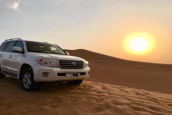 Sunset Desert Safari With BBQ Dinner, Camel Ride, Belly Dancing from Dubai - Dune bashing, sand boarding, and sunset photos