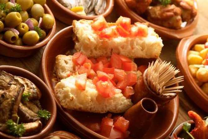 Tapas and Flamenco Show Small Group Tour in Barcelona - First tastes: patates braves and pa amb tomàquet