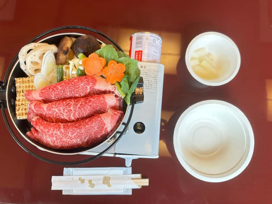 Tokyo: Yakatabune Dinner Cruise with Japanese Show & Drinks - Sukiyaki dinner, table cooking, and unlimited soft drinks